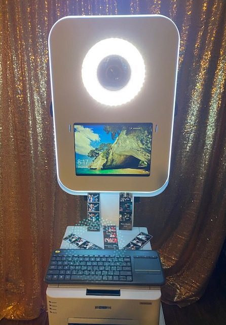 A computer with a light on top of it